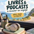 Un conducteur heureuse écoutant un livre audio pendant un road trip.